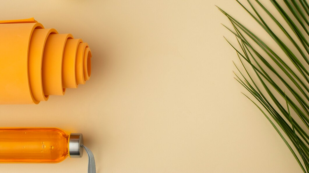 flat-lay-orange-water-bottle-mat_23-2149442731